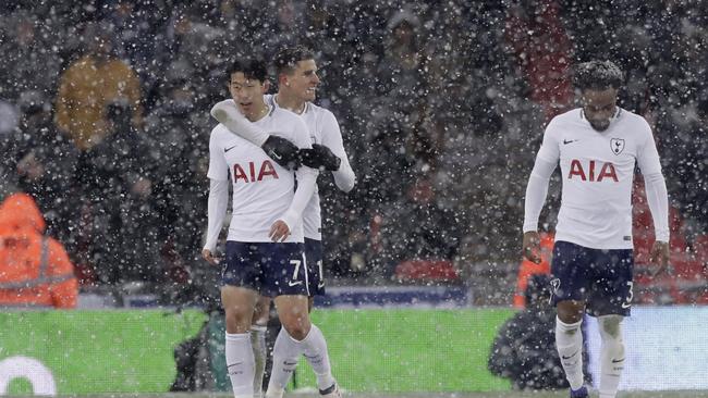 Tottenham Hotspur's Son Heung-ming, left, celebrates with teammates