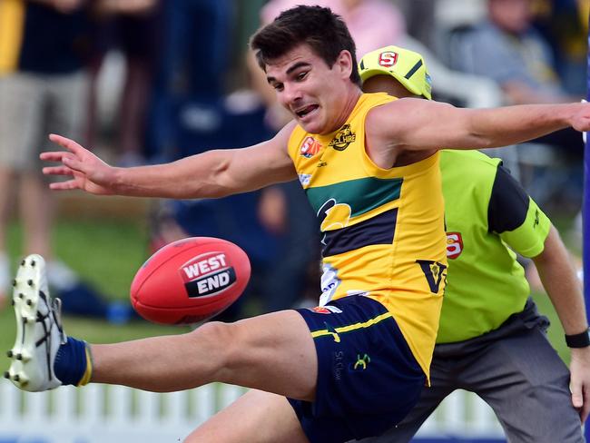 08/04/18 - SANFL EAGLES v CENTRAL at Woodville Oval.  Eagles Jake Johansen attempts to kick the ball over the goal line under pressure from Sam Milne. Picture: Tom Huntley