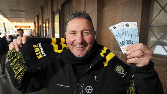 Peter Smith of Eltham was the first to get Grand Final tickets at the Exhibition Street Ticketek outlet. Picture: Andrew Henshaw