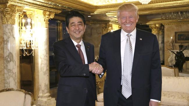 Donald Trump and Shinzo Abe, then presidents of the US and Japan, meet at Trump Tower in 2018. The building is likely to end in the hands of receivers. Picture: The Yomiuri Shimbun / AP