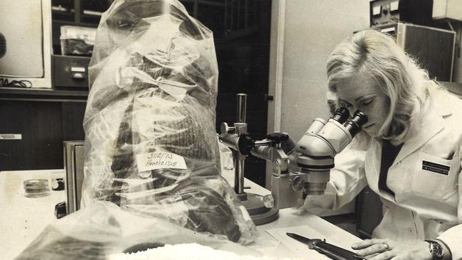 June 1973: Forensic technology went ahead in leaps and bounds in the 1970s. Here, biochemist Pauline Hentorn examines a flick-knife to identify and group bloodstains at the Victoria Police forensic science laboratory. Picture: Herald Sun