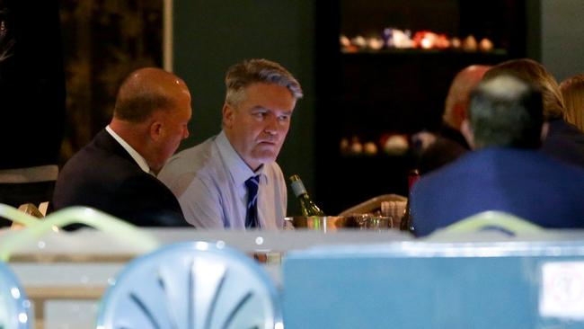 Mathias Cormann, centre, and Peter Dutton, left, having dinner at Portia’s Place restaurant in Canberra in August last year. Picture: Jonathan Ng