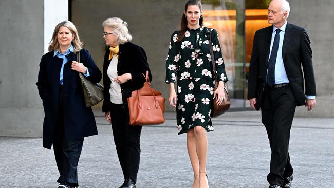 Amanda Talbot (far left), the widow of billionaire mining mogul Ken Talbot, and his daughter Alexandra (in floral dress) leave the Supreme Court in Brisbane. Picture: NCA NewsWire / Dan Peled