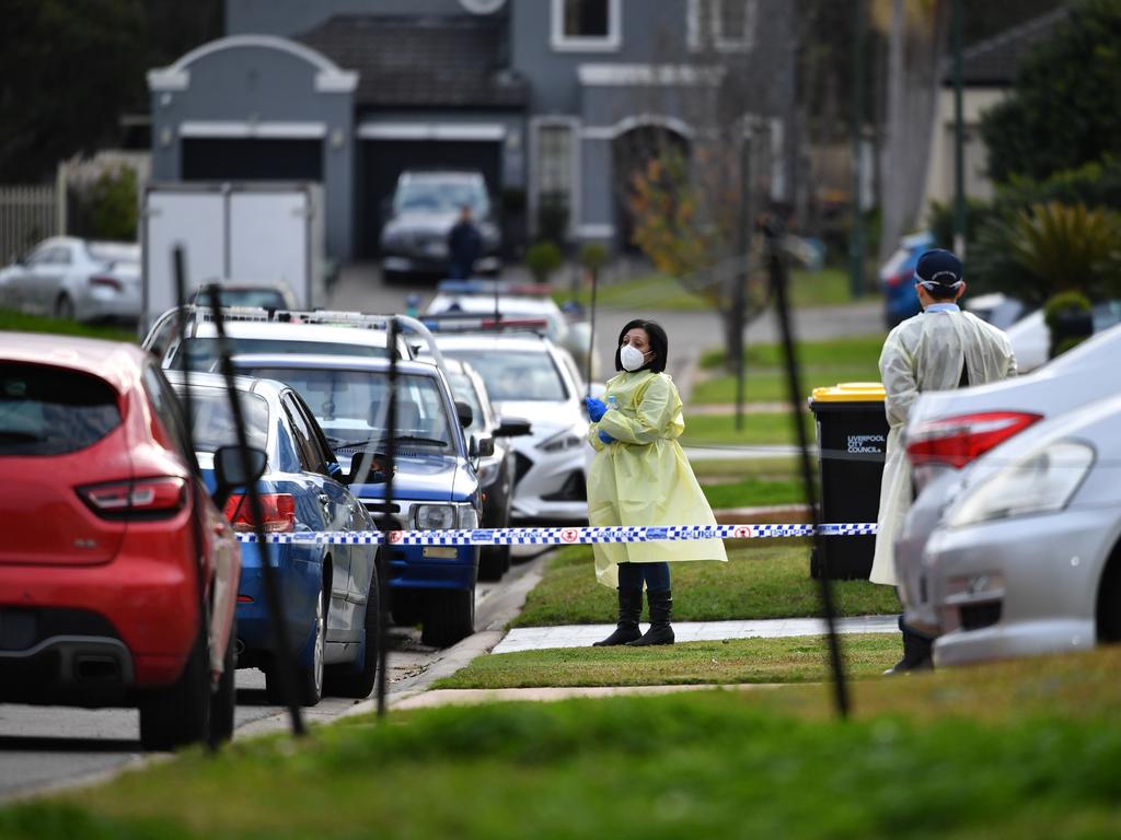 Emergency services personnel wearing PPE at Thursday Place, Green Valley on Monday. Picture: NCA NewsWire/Joel Carrett