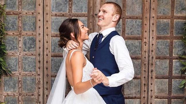 Alex McKinnon defied the odds to stand as he married his partner Teigan Power. Picture: Instagram