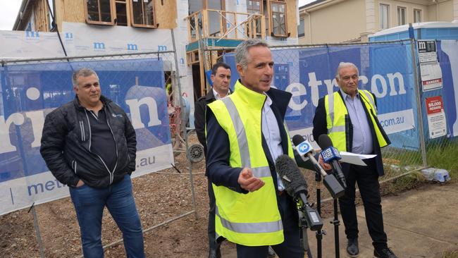 Metricon acting chief executive Peter Langfelder speaks about the state of the home building company alongside acting executive chairman Ross Palazzesi and suppliers. Picture: Kiel Egging