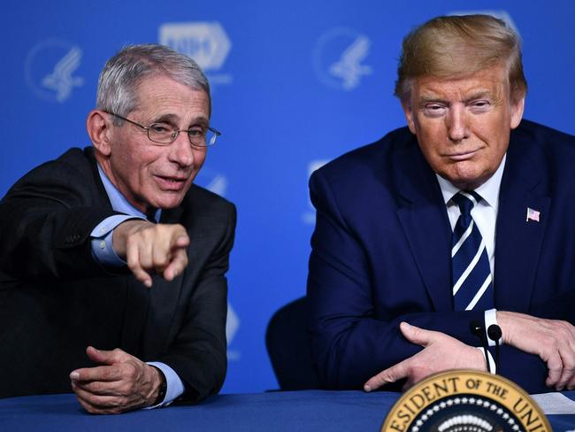 (FILES) US President Donald Trump and Anthony Fauci, director of the NIH National Institute of Allergy and Infectious Diseases attend a meeting at the National Institutes of Health in Bethesda, Maryland on March 3, 2020, following up on the COVID-19, coronavirus, outbreak. Opinion polls show Democrat Kamala Harris and Republican Donald Trump running ina statistical tie for the November 5, 2024 election, including in the seven battleground states likely to decide the national vote. (Photo by Brendan Smialowski / AFP)