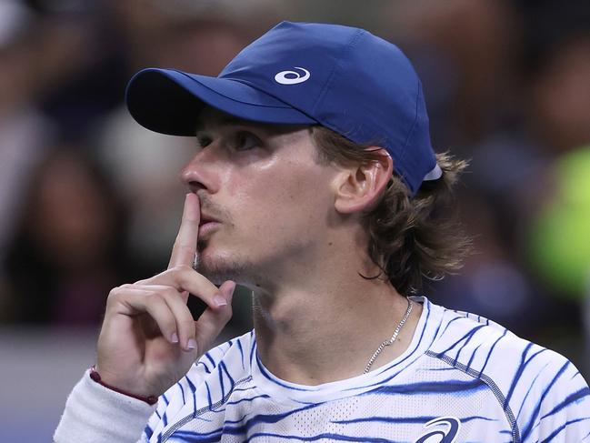 NEW YORK, NEW YORK - AUGUST 31: Alex de Minaur of Australia motions to the crowd to stop booing against Daniel Evans of Great Britain for losingduring their Men's Singles Third Round match on Day Six of the 2024 US Open at USTA Billie Jean King National Tennis Center on August 31, 2024 in the Flushing neighborhood of the Queens borough of New York City. (Photo by Matthew Stockman/Getty Images)