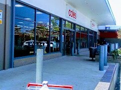 Man, 20, allegedly threatens Coles staff with axe