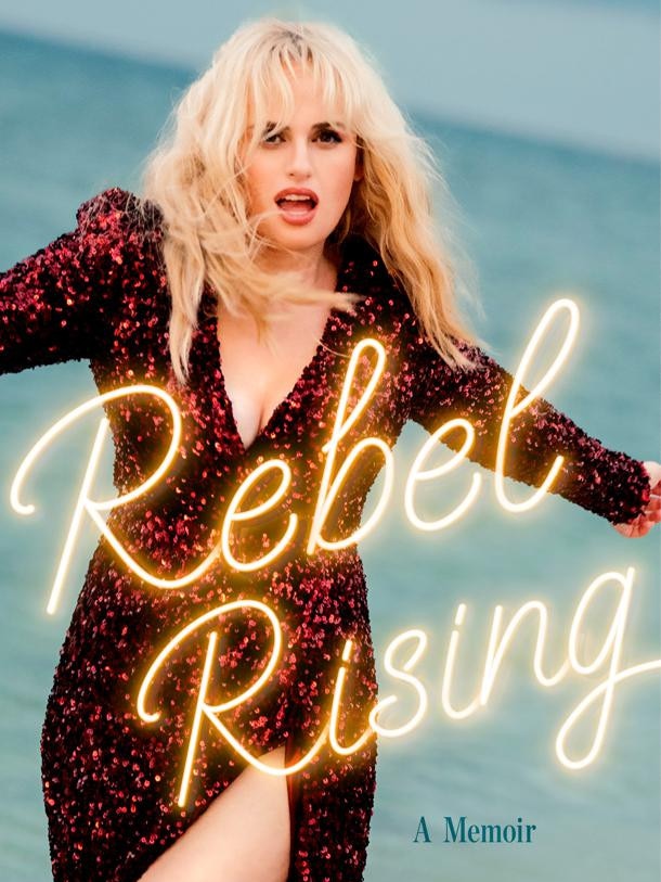 The cover of Rebel Rising by Rebel Wilson.