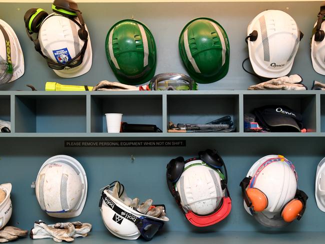 Workers helmets and safety equipment on display at the Qenos Altona plant in Melbourne, Monday, August 28, 2017. Earlier the Federal Opposition Leader Bill Shorten joined local Labor members, Joanne Ryan and Tim Watts on a tour at Qenos Altona Gas plant. (AAP Image/Joe Castro) NO ARCHIVING