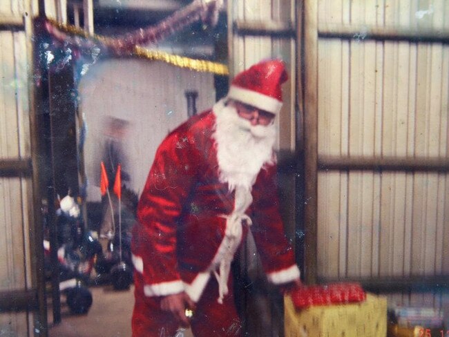 The father: Charlie Colt dressed up as Santa Claus to lift the spirits of the kids. He is pictured here on Christmas Day, 2006. All the following names have been changed for anonymity.