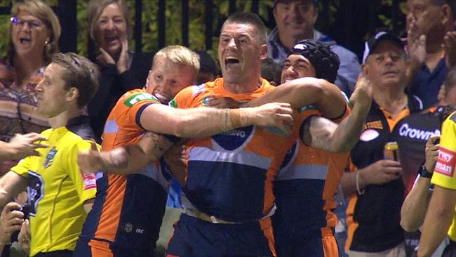 Newcastle players celebrate the winning try.