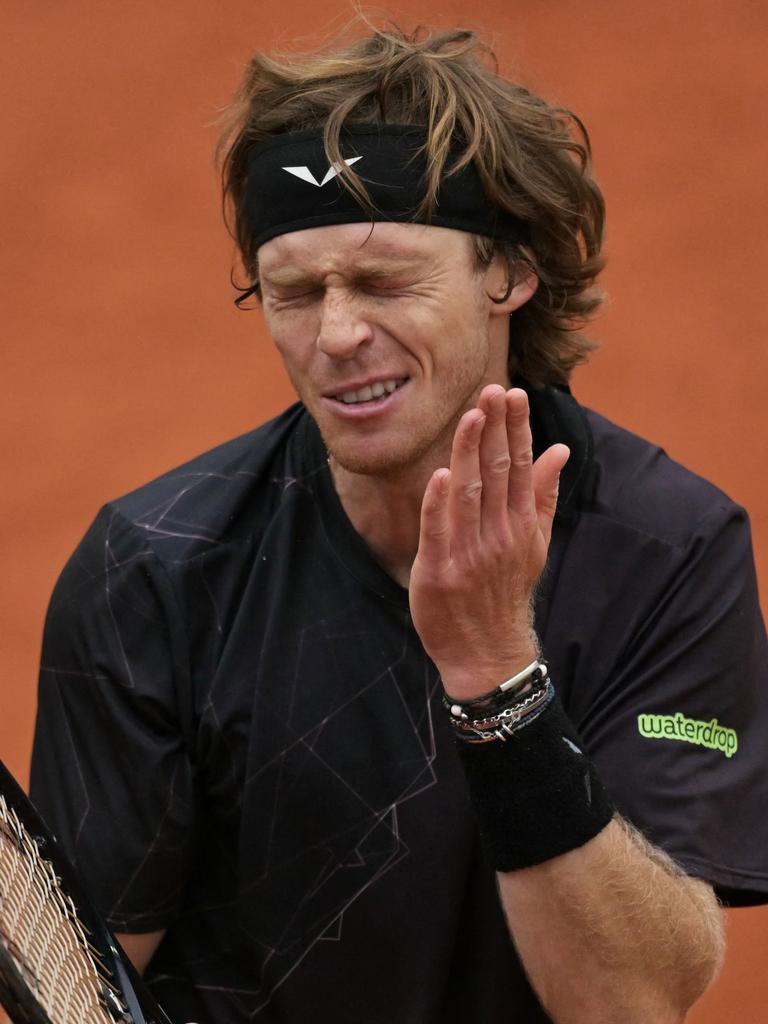 Rublev was slapping himself. (Photo by Bertrand GUAY / AFP)