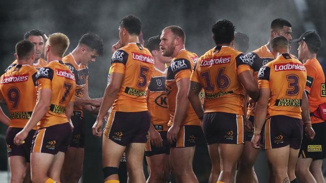 Dejected Brisbane players after a try by Souths Adam Reynolds during the Souths v Broncos NRL match at ANZ Stadium, Homebush. Picture: Brett Costello