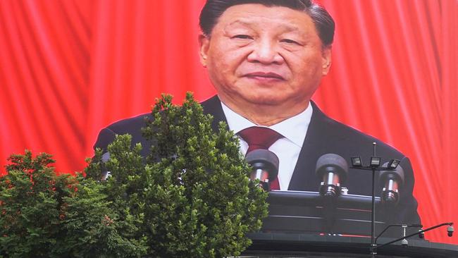 An outdoor screen showing Xi’s speech. Picture: AFP