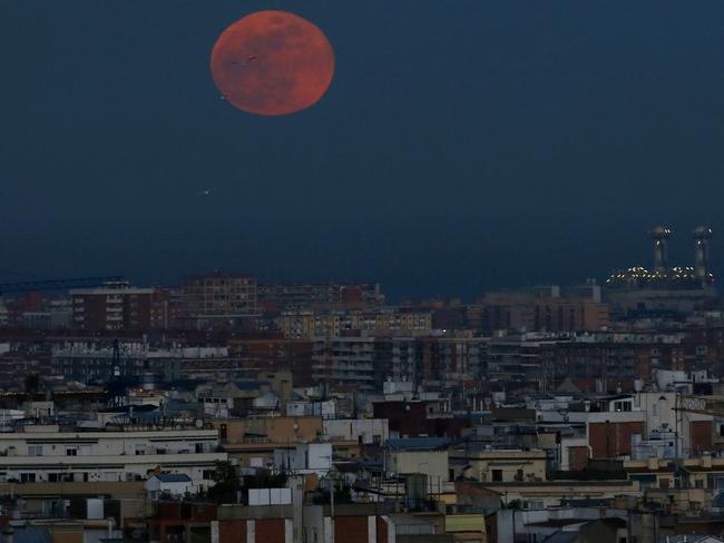 The super blue blood moon is seen setting in Barcelona, Spain. Picture: AP