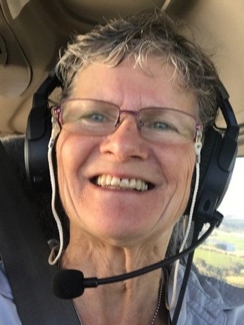 Pilot Lesleigh Griffin, 71, who had an emergency landing at Wynyard Airport with her twin sister Billie Hicks behind the tail of their plane. Picture: Supplied