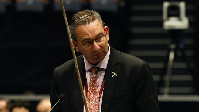 Queensland cabinet minister Craig Crawford presents a broken tipped spear to parliament, gifted by Guugu Yimithirr elder Fred Deeral, during the regional sitting at the Cairns Convention Centre. Picture: Brendan Radke