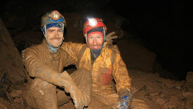 Gabriel Kanzler and Alan Jackson covered in mud after exploring a remote region of the cave. Picture: STEFAN EBERHARD