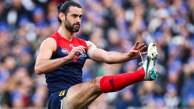 MELBOURNE, AUSTRALIA - JUNE 12: Brodie Grundy of the Demons kicks the ball during the 2023 AFL Round 13 match between the Melbourne Demons and the Collingwood Magpies at the Melbourne Cricket Ground on June 12, 2023 in Melbourne, Australia. (Photo by Dylan Burns/AFL Photos via Getty Images)