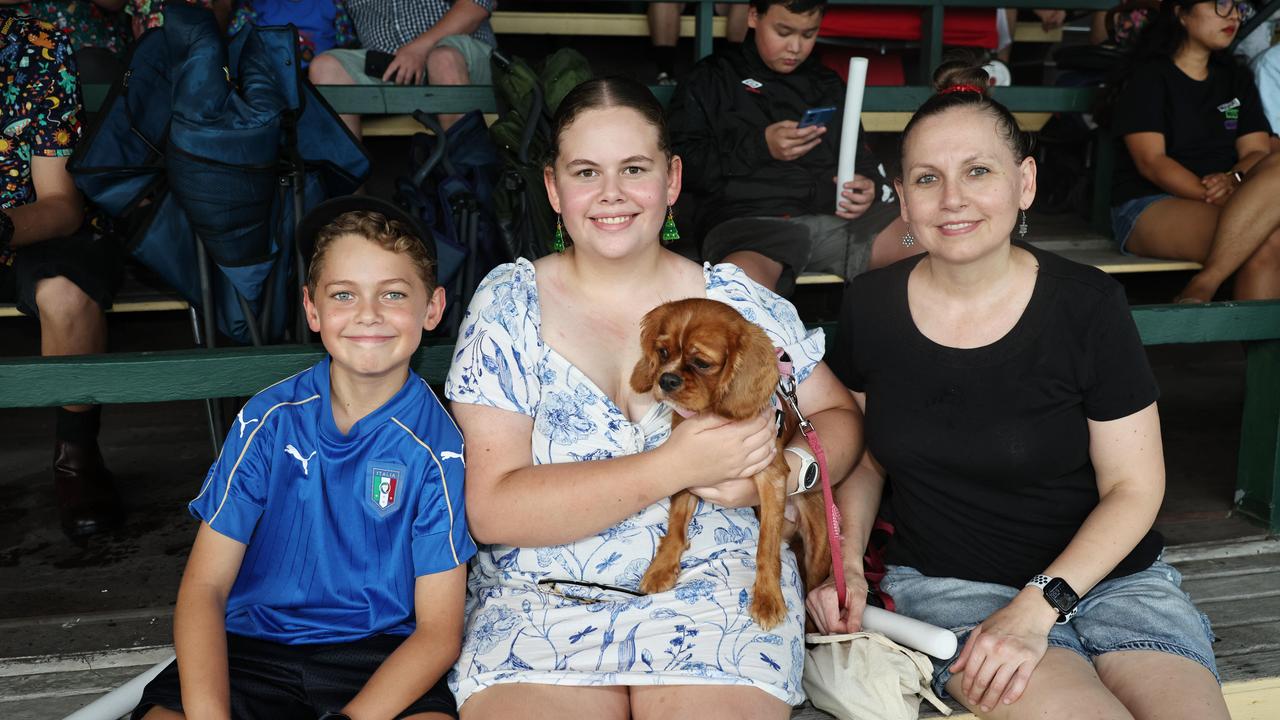 Andrew Vakaruru, 10, Karina Vakaruru, 15, with Bella the dog, and Sidionia Nechita at the Cairns Churches Joy to the World Community Carols, held at the Cairns Showgrounds. Picture: Brendan Radke