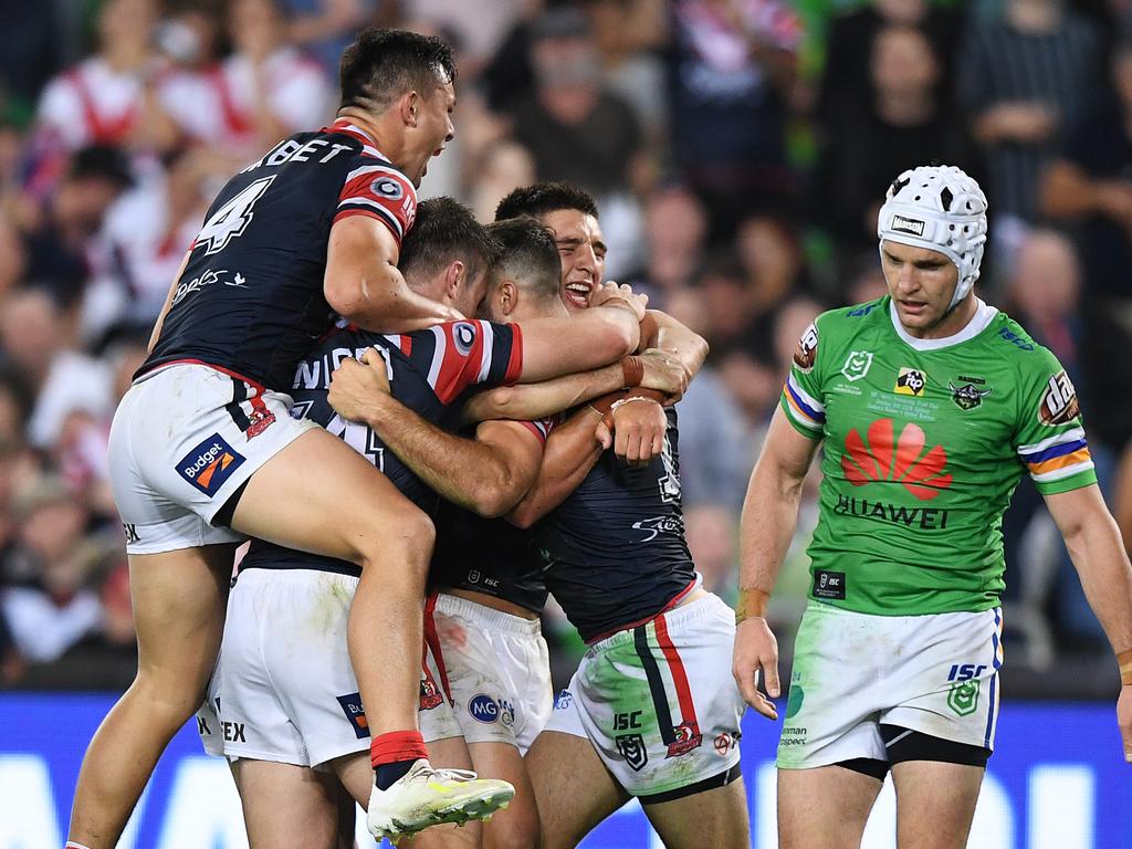 James Tedesco of the Roosters celebrates with teammates after scoring a try during the 2019 NRL Grand Final between the Canberra Raiders and the Sydney Roosters at ANZ Stadium in Sydney, Sunday, October 6, 2019. (AAP Image/Joel Carrett) NO ARCHIVING, EDITORIAL USE ONLY