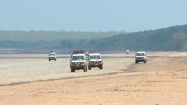 A teenager is in a critical condition after he fell off a ute at Gunn Point on Saturday. Picture: Brad Fleet