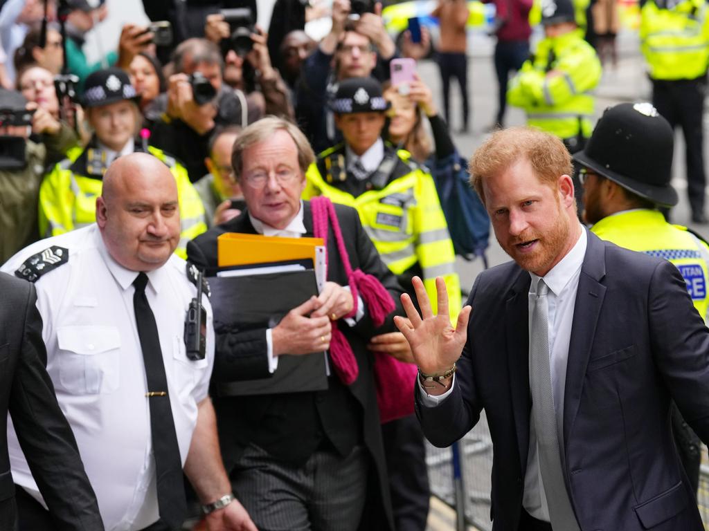 Prince Harry waves at crowds as he arrives at the High Court to resume giving evidence against the Mirror Group. (Photo by Carl Court/Getty Images)