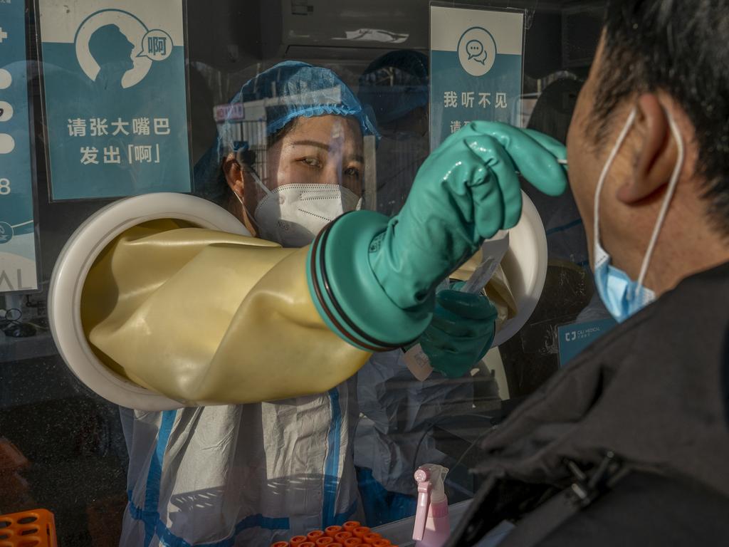 A medical worker performs a PCR test in Beijing, China. In the city of Tianjin, 100 km southeast of Beijing, the entire population of 14 million is being tested. Picture: Andrea Verdelli/Getty Images