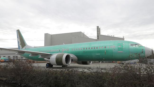 A Boeing 737 MAX 8 being built for Oman Air sits parked at Boeing Co.'s Renton Assembly Plant, Monday, March 11, 2019, in Renton, Wash. Airlines in several countries grounded the same model jetliner Monday following Sunday's crash of an Ethiopian Airlines Boeing 737 Max 8, the second devastating crash of one of the planes in five months. (AP Photo/Ted S. Warren)