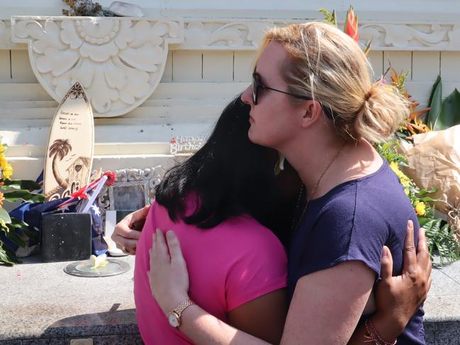 Australian Natalie Juniardi with her son and relative at the memorial in Legian, Kuta Picture. Lukman S. Bintoro