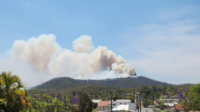 A bushfire burning on the ridge line behind the Atherton Tablelands town of Herberton on Wednesday. Picture; Supplied