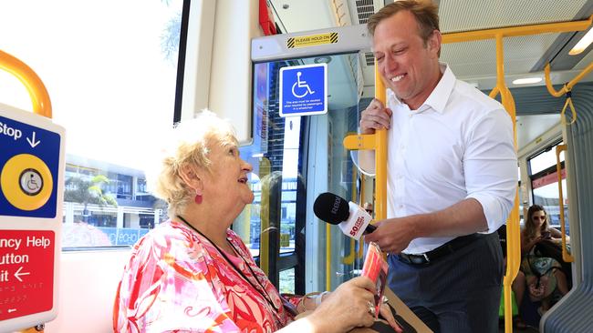 Queensland Premier Steven Miles speaking to a voter on a Gold Coast tram. Picture: Adam Head