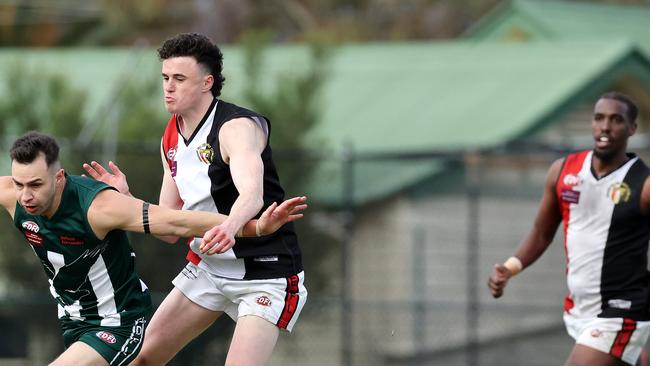 Brendan Godden of Airport West battles with Patrick Mccallum of West Coburg. Picture: George Salpigtidis