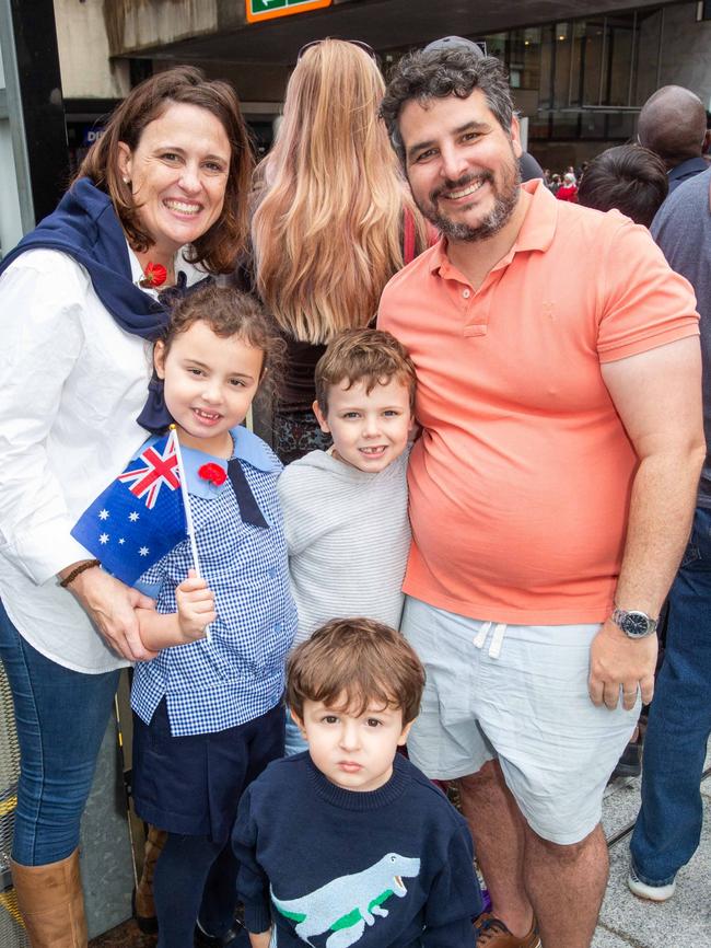 Thousands of people have braved the rain to gather in Brisbane for Anzac Day services. Picture: Grace Kessels