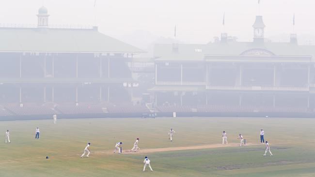 Choking bushfire smoke almost obscures the historic stands at the SCG