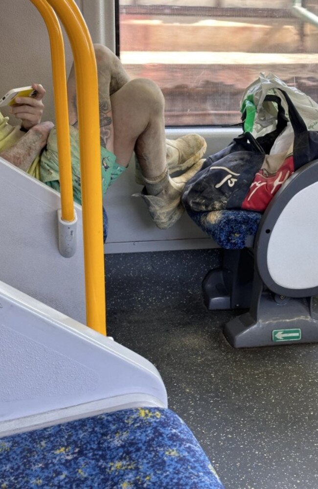 Sydney train commuter snaps at woman for placing her dirty shoes