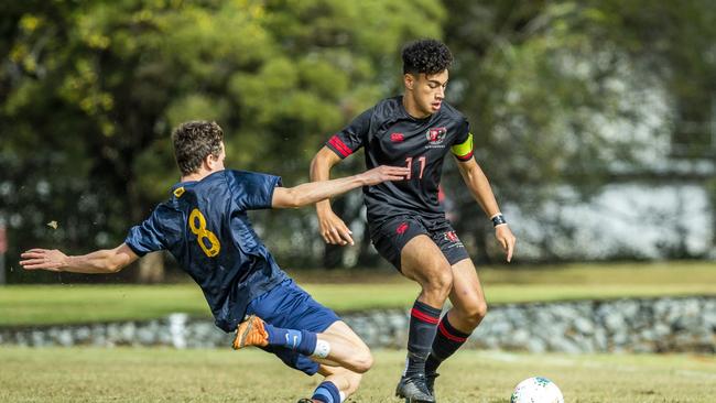 Toowoomba's Jack DeBortoli goes in for the tackle on Malakai Love-Semira from St Joseph's Gregory Terrace. Malakai scored a goal for Terrace. Picture: Renae Droop