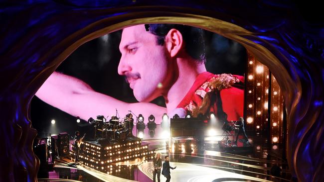 An image of the late Freddie Mercury is projected onto a screen while Adam Lambert + Queen perform onstage during the 91st Annual Academy Awards.