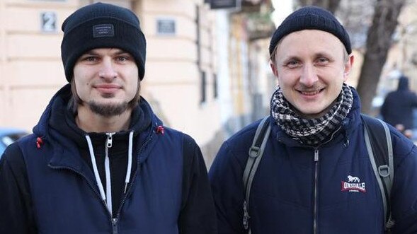 Volodymyr and Mirislav at the gates of Lviv army barracks to sign up to fight Russians. Picture:y Viktor Moskaliuk