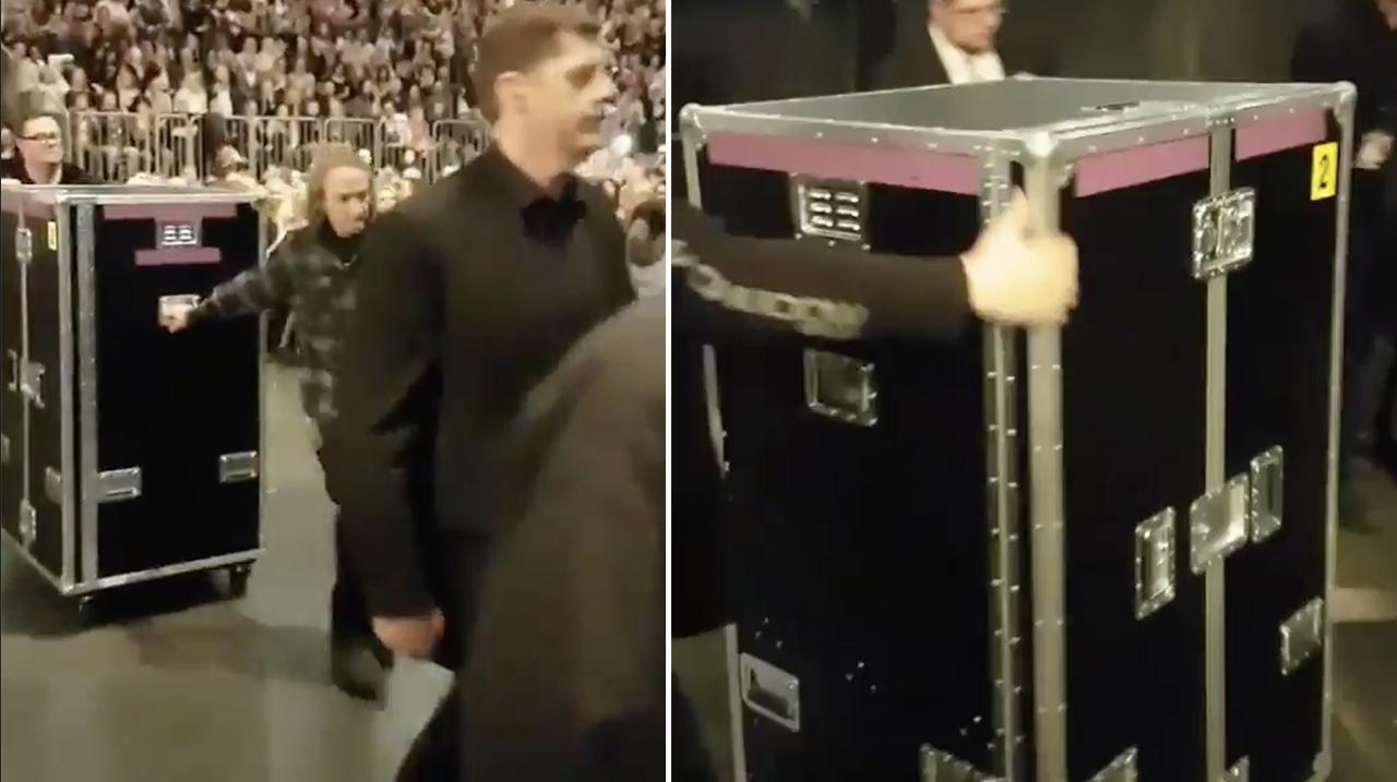 Adele wheeled into concert in a box 
