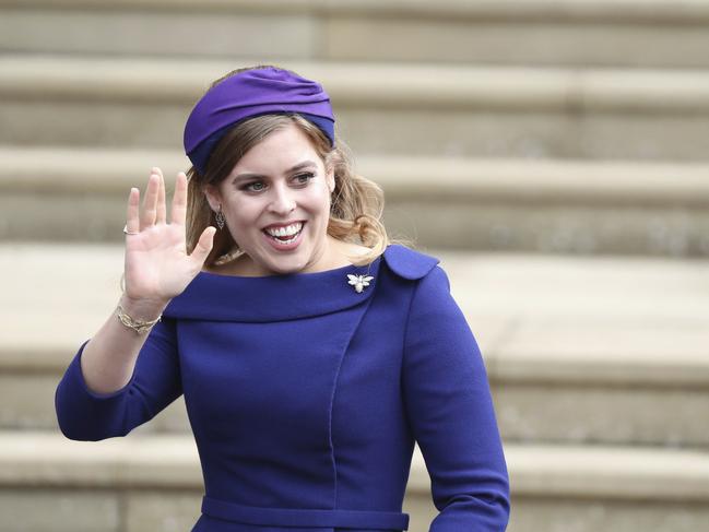 Princess Beatrice arrives for the wedding of Princess Eugenie of York and Jack Brooksbank at St George’s Chapel, Windsor Castle, near London, England, Friday Oct. 12, 2018. (Steve Parsons/Pool via AP)