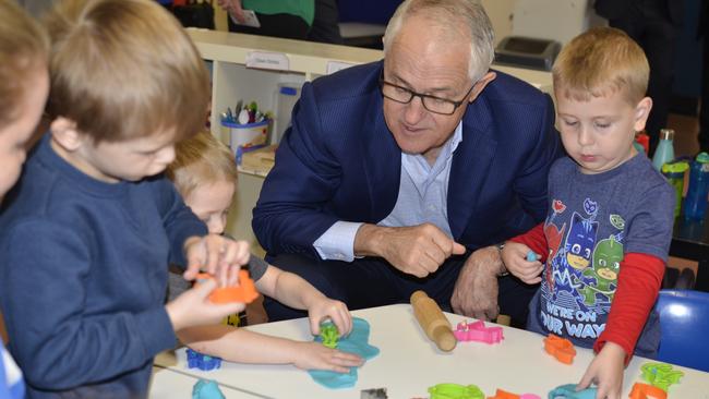 AEIOU funding from new centre. Picture David Alexander  Prime Minister Malcolm Turnbull with Roman Griffin, Milo Norman and Zachariah King