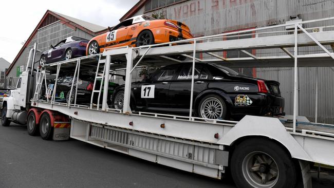 Race cars on a transporter at the scene. Picture: Tricia Watkinson