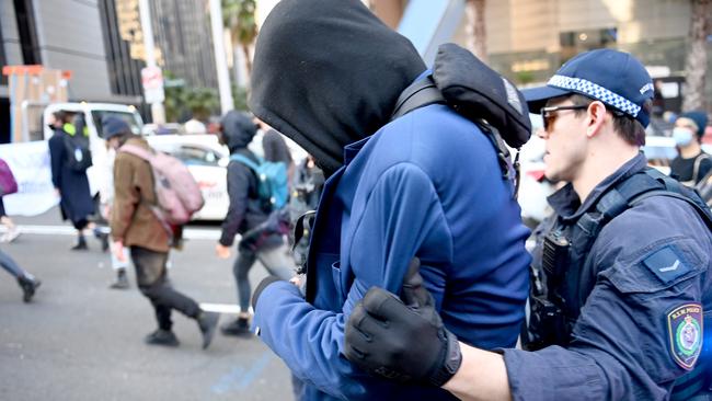 A police officer leads a protester away at Monday’s protest. Picture: NCA NewsWire/Jeremy Piper