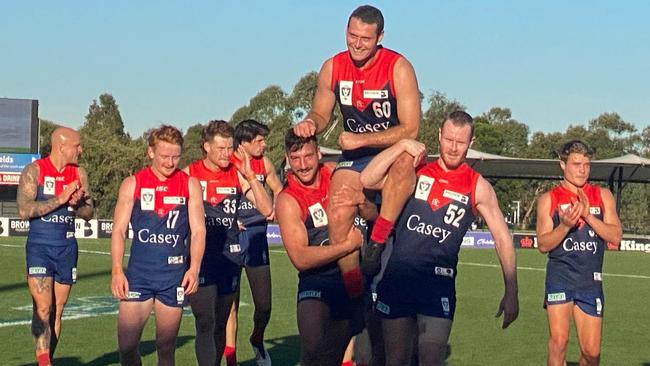 Jack Hutchins is carried from the ground at a sunny Casey Fields on Sunday.