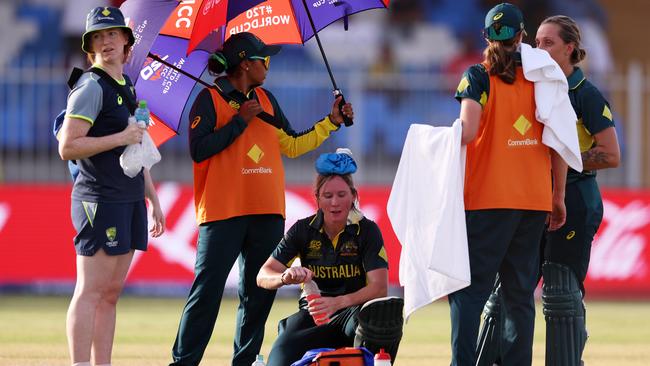 Beth Mooney of Australia cools down with an ice pack. Photo by Matthew Lewis-ICC/ICC via Getty Images