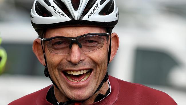 Former prime minister Tony Abbott is seen during the Pollie Pedal Bike Ride in Warragul, Victoria, Monday, April 9, 2018. Tony Abbott is sharing his words of wisdom as his coalition successor racks up the 30th Newspoll loss for the federal government. As Malcolm Turnbull matched the test he set when he deposed Mr Abbott, the former prime minister again urged the government to champion low power prices, by keeping coal, and higher wages, by cutting immigration. (AAP Image/Joe Castro) NO ARCHIVING