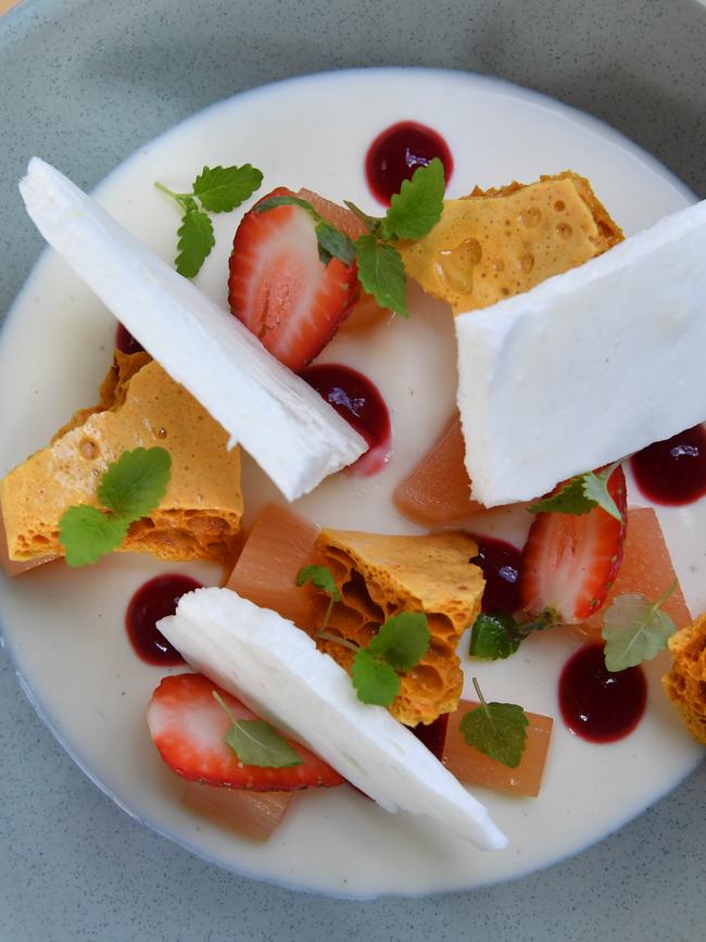 Buttermilk pana cotta, poached rhubarb, honeycomb, meringue and raspberry coulis at Coccobello Picture: Keryn Stevens/AAP